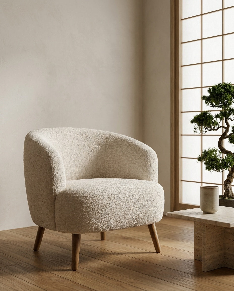 The Pebble Chair — Cream Bouclé styled in a living room