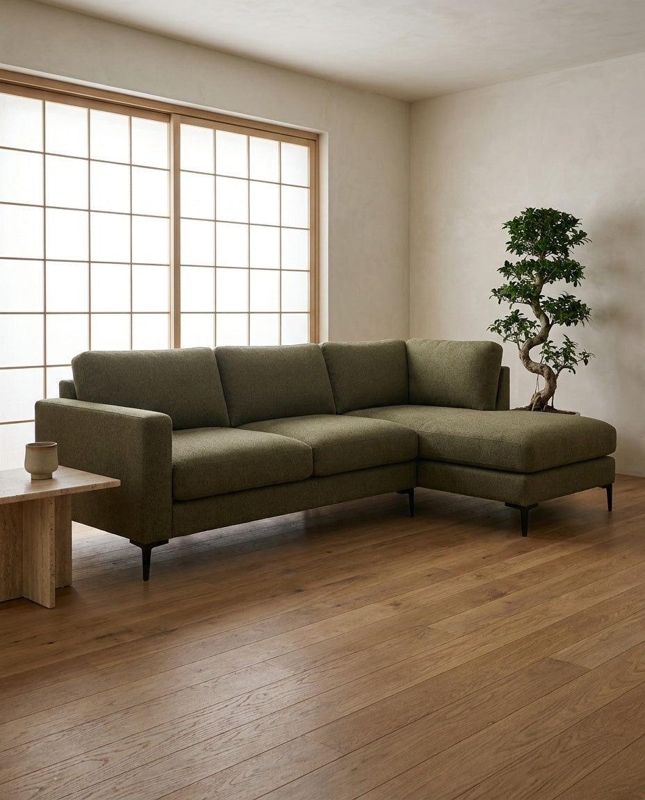 The Frae Chaise Sofa — Olive Green Fabric styled in a living room
