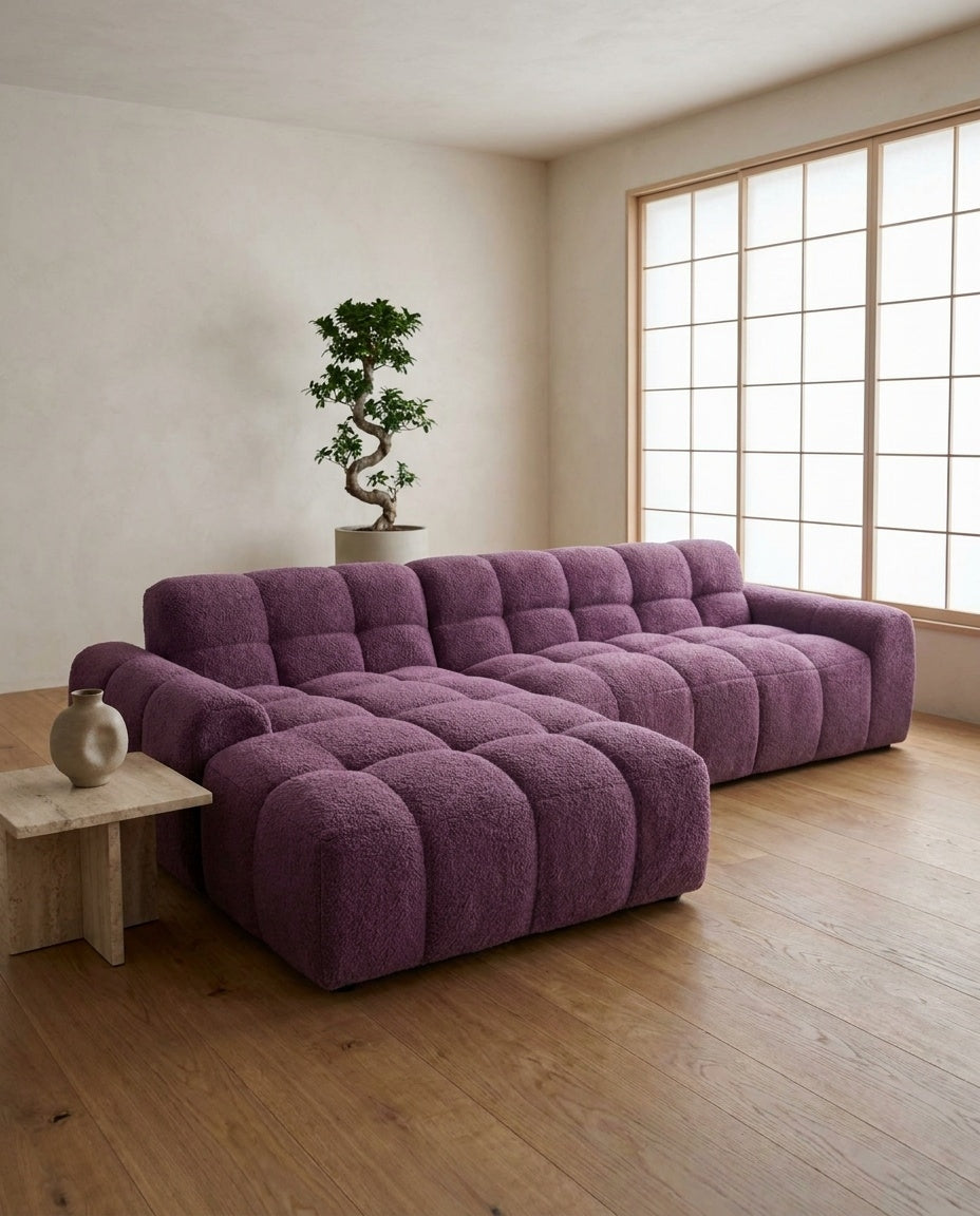 The Marshmallow Sectional — Plum Bouclé styled in a living room