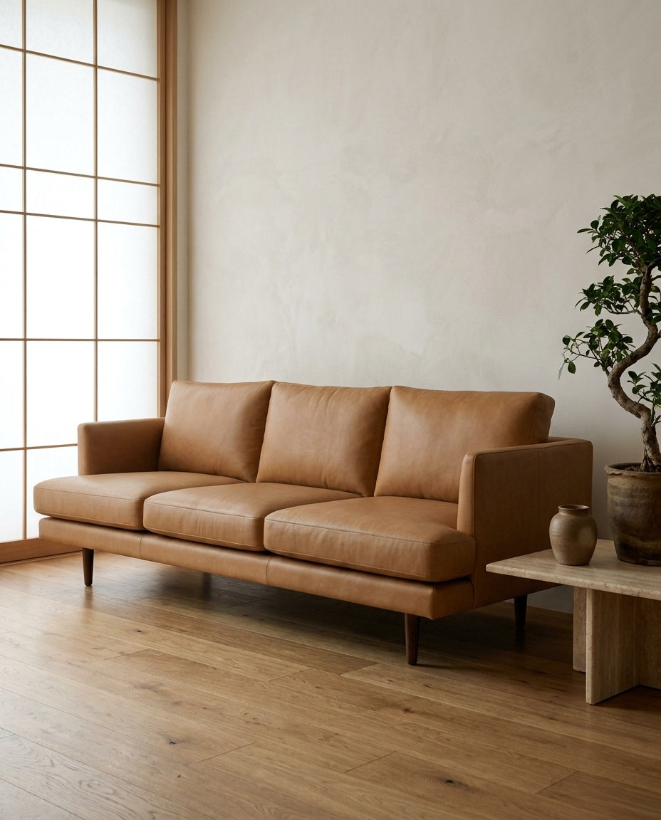 The Nordic Sofa — Tan Leather styled in a living room