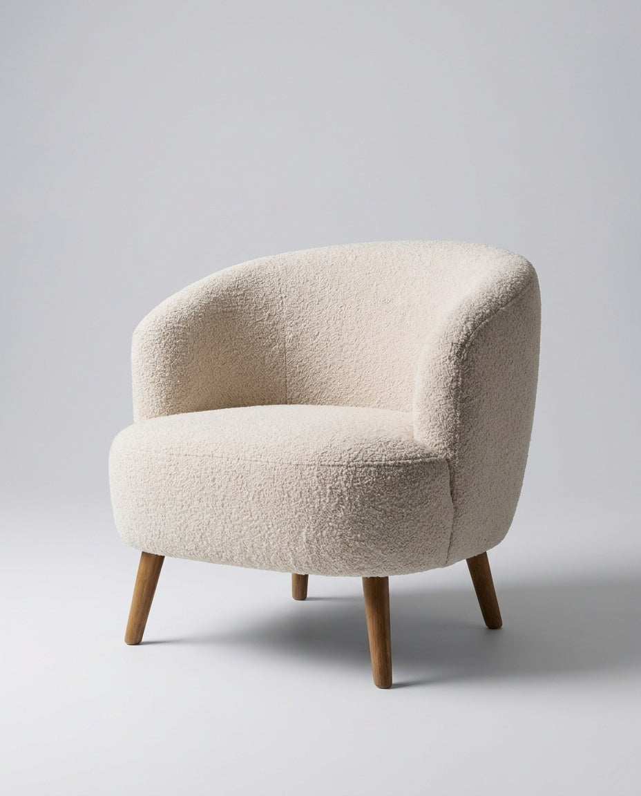 The Pebble Chair — Cream Bouclé — three-quarter view